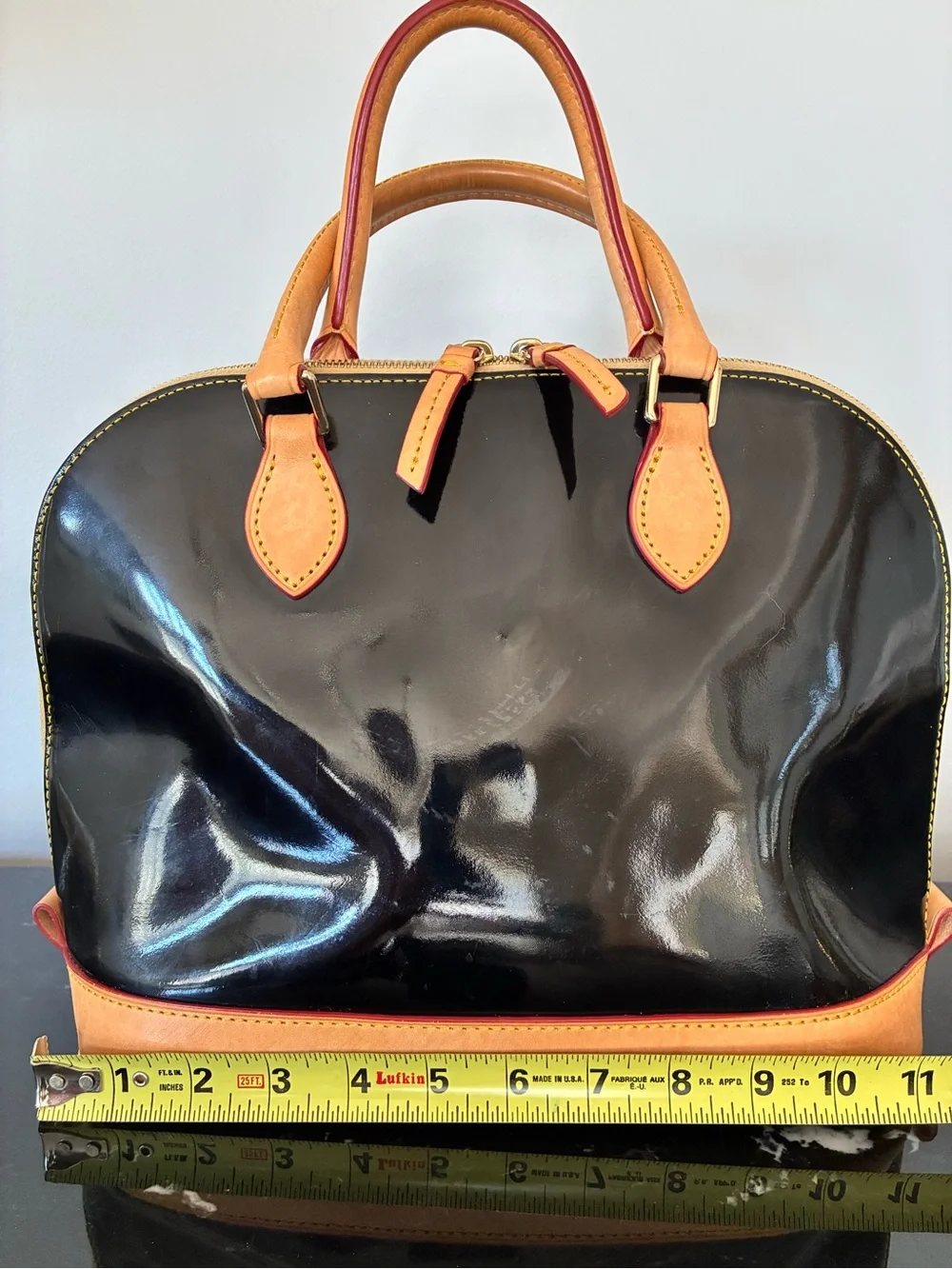 Dooney & Bourke Black Patent Leather Satchel with Tan Trim and Red-Accent Strap